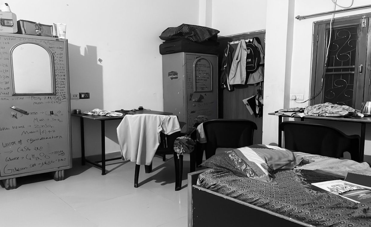 a black and white photo of a messy room